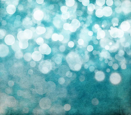 Glowing bokeh effects on a textured paper backgroundの写真素材