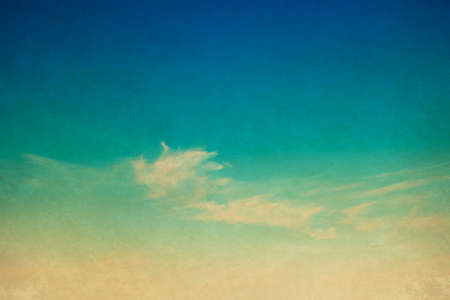 Blue sky with clouds in grunge style.の写真素材