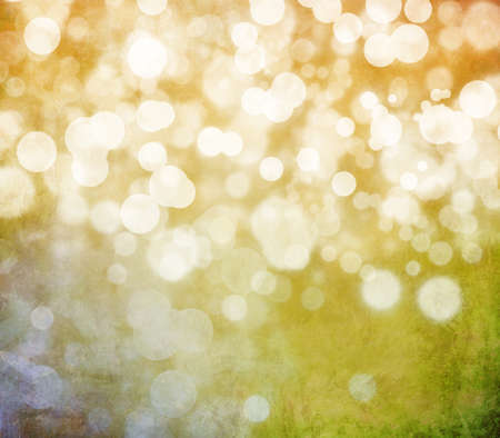 Glowing bokeh effects on a textured paper backgroundの写真素材
