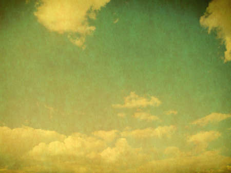 Vintage background in the blue shade with cloudsの写真素材