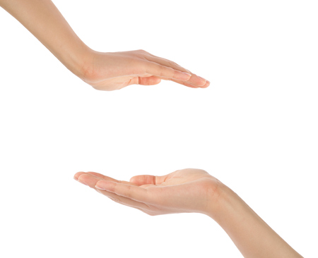 Close-up of beautiful woman's hand, palm up. Isolated on white backgroundの写真素材