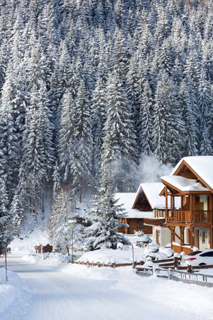Winter vacation holiday wooden house in the mountains covered with snow