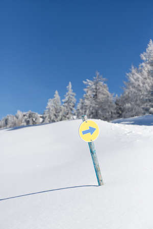 Turn right direction sigh on a ski resort in the Austrian Alps