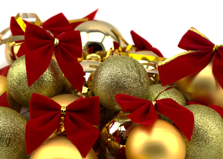 Christmas golden balls with red ribbons on a white backgroundの写真素材