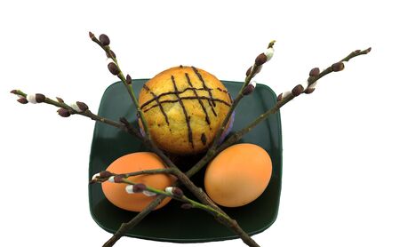 eggs and cake on a plate and willowの写真素材