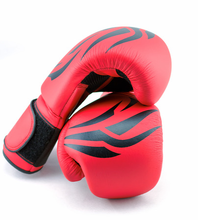 red boxing gloves on a white backgroundの写真素材