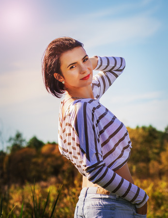 portrait of a beautiful young girl on natureの写真素材