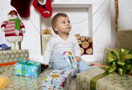 little boy around a Christmas fireplaceの写真素材