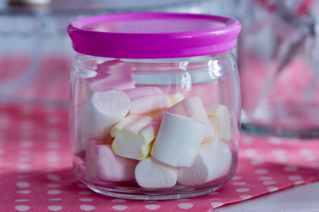 colorful marshmallow in a glass jarの写真素材