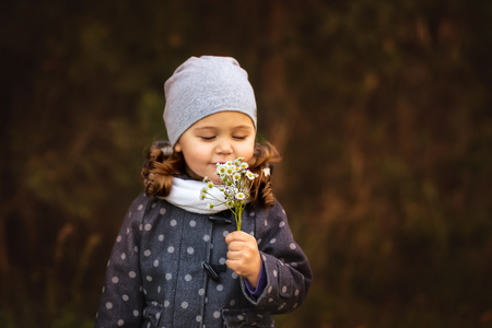 girl walking in the forest in autumnの写真素材
