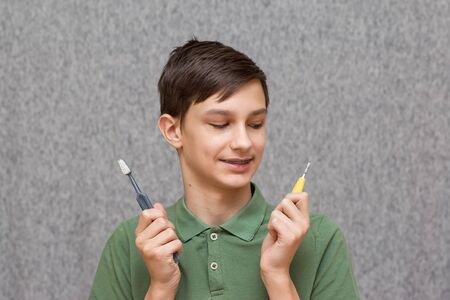 teenager with braces and toothbrushの写真素材