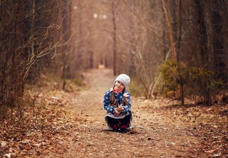 little cute girl in the spring forest