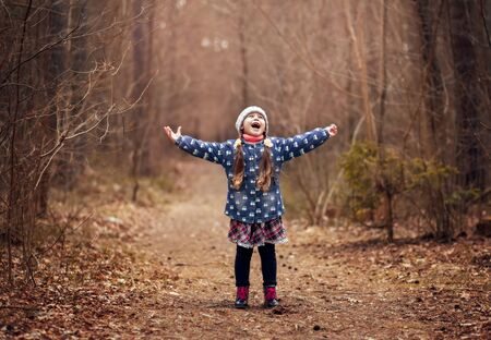 little cute girl in the spring forestの写真素材
