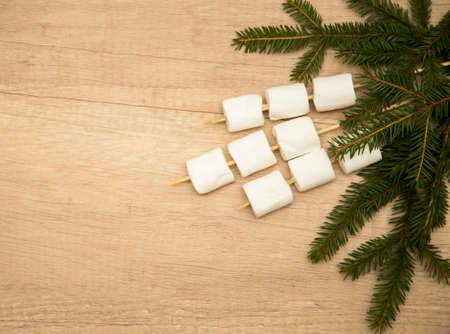 marshmallows. Composition with fir branches. Flat lay. Christmas and new year