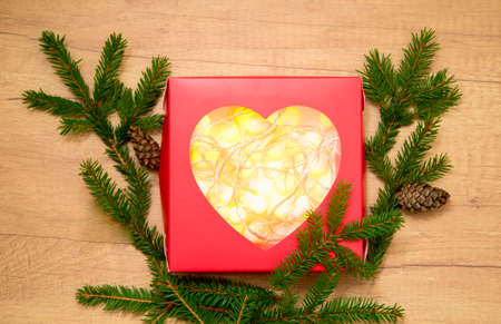 New Year and Christmas balls in a red gift box