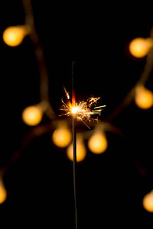 sparkler burning on a black background. new Year