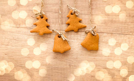gingerbread cookies on a wooden background. Christmas tree cookies