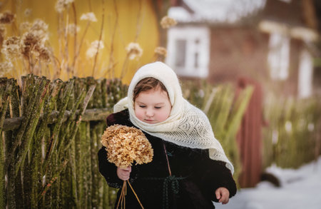 Little girl walks in nature in winter. Winter clothingの写真素材