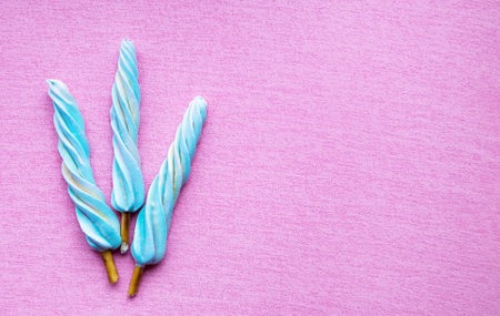 Marshmallow on a stick on a pink background. Copy spaceの写真素材