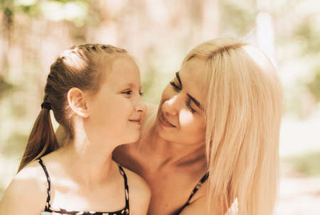 Mom holds a little girl daughterの写真素材