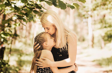 Mom holds a little girl daughter