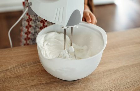 Whisking Cream Cheese mascarpone with Sugar for the Cake tiramisu
