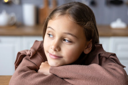 Close up headshot portrait of smiling little school girl. Virtual event concept.の写真素材