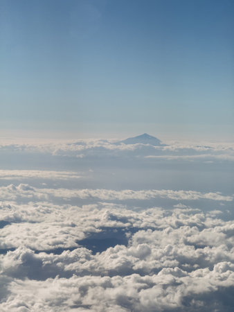 View of the Teide volcano from the airplane window. Flight to Tenerife and the Canary Islandsの写真素材