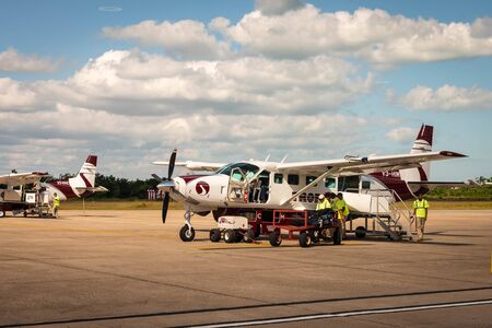 Belize City, Belize - November, 18, 2019. Domestic Tropic Air airline getting ready for passengers...