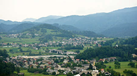 view of Bled, Julian Alps mountains and houses, Bled, Slovenia