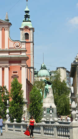 Triple Bridge 3 bridges across Ljubljanica and Franciscan Church in the city center, sunny dayのeditorial素材