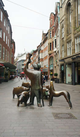 Bremen, Germany - View of Mumps and his pigs - Pig Herder statue in the streetのeditorial素材