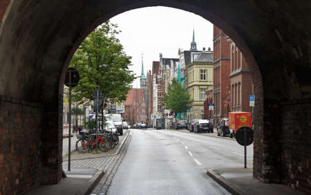 Lubeck, Germany - View of street through the arch of Burgtor northern Gate, beautiful architectureのeditorial素材