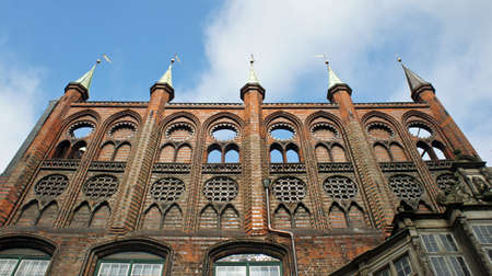 View of the medieval old town hall or Lubecker Rathaus, blue sky, beautiful architecture, Lubeck