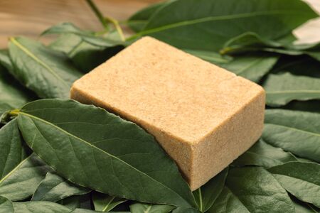 natural homemade bay laurel natural soap on green background