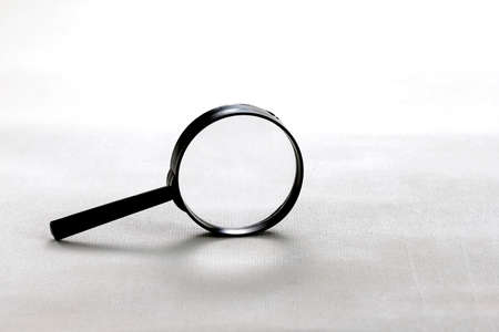 Magnifier glass with shadow isolated on white background. Front view