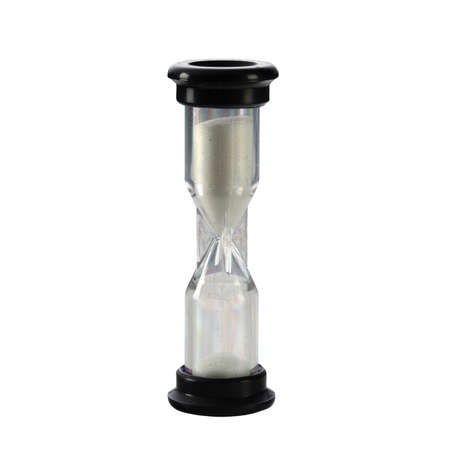 Sand in hourglass isolated on white background. Time passing concept vertical photo