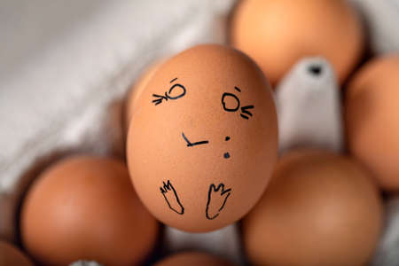 Eggs Faces, drawnigs on eggs on blur background.