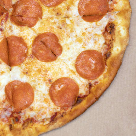 hot pizza with pepperoni and salami close upの写真素材