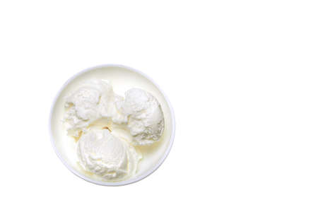 top view white bowl with white ice cream isolated on white background. flat layの写真素材