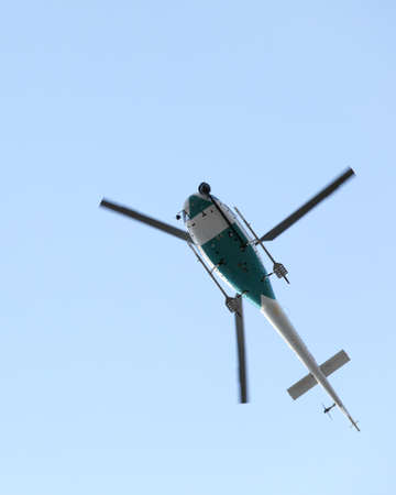 Helicopter holding video camera filming. Some motion blur on rotor blades.の写真素材