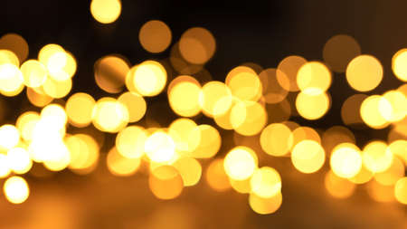 background bokeh texture black and yellowの写真素材