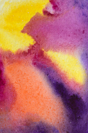 Bright red, purple and yellow colors mixed spots and streaks. Aquarelle gradient on paper background.の写真素材