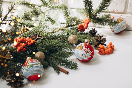 New Year, Christmas background. New Years decor on a white background with branches of a green Christmas tree. Front viewの写真素材