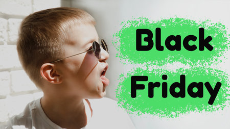 Portrait of a boy in sunglasses grimaces, screaming with sign of black friday. Shopping concept, sale. Front viewの写真素材