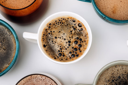 A set of mugs with different coffees on a white background. Flat layの写真素材