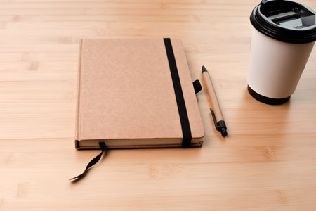 Template with stationery. Natural notebook with a pen made of eco materials and a cap of coffee on a...