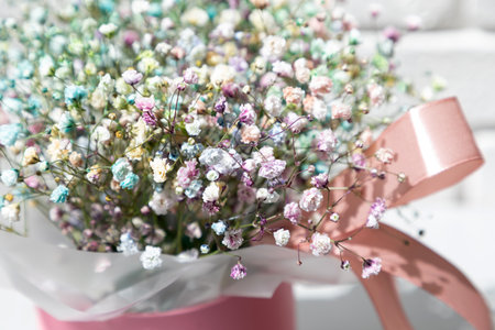 Bouquet of dry multicolored flowers close-up on a grey background. Background, pattern. Top viewの写真素材