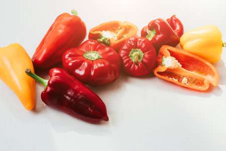 Bell peppers of different sizes on a concrete background. Garden background, bell pepper harvest. Ripened red and yellow paper. Top viewの写真素材