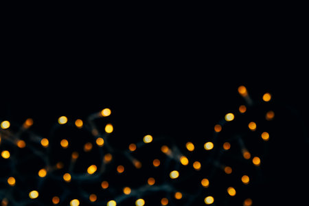 Abstract background of blurred yellow lights for design. Lights bokeh dis focus. Christmas background, copy spaceの写真素材